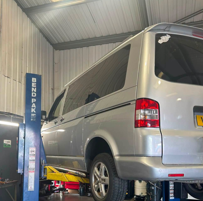 VW Transporter van on the two-post BendPak lift